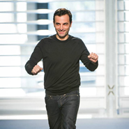 Nicolas Ghesquière takes a bow after his first Louis Vuitton runway show