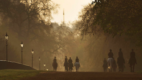 Horses out for a canter around London's Hyde Park at sunrise. Copyright Chris Evans