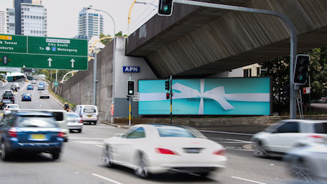 Tiffany billboard below an overpass