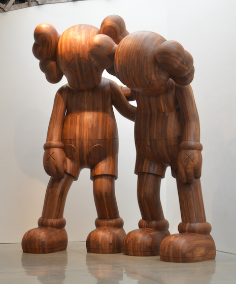 The KAWS “ALONG THE WAY” (2013) wooden sculpture from the collection of the artist will be on display at the Yuz exhibition. (Courtesy of Yuz Museum, collection of the artist)