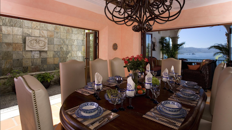 A dining table set at the Casa Dos Cisnes villa in Puerta Vallarta, Mexico